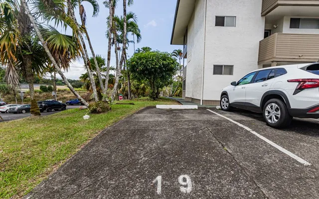 a view of a car parked in front of a house