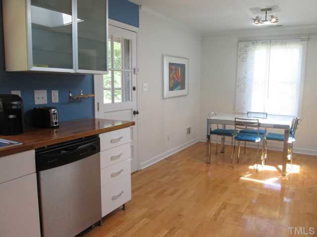 3409 Astro Court Raleigh, NC 27604 - Photo 14 of 25 The breakfast/dining room features hardwood floors and new lights! Great open space convenient to kitchen for easy serving of meals for family and friends! Open and bright makes this room very cheery!
