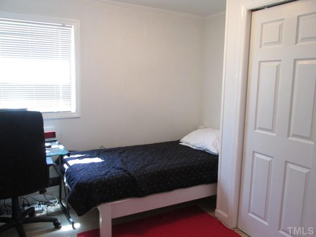 3409 Astro Court Raleigh, NC 27604 - Photo 21 of 25 This is the lower level bedroom with tile floors! Nice closet! This lower level has an outside entry as well! Lots of natural light!