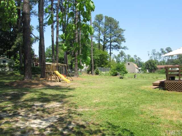3409 Astro Court Raleigh, NC 27604 - Photo 5 of 25 Large backyard with shade trees on back! NO HOA dues or an HOA telling you what you can and can't do! Backyard is partly fenced and would be easy to finish fencing if you wanted to!