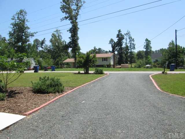 3409 Astro Court Raleigh, NC 27604 - Photo 8 of 25 This is from the driveway looking out showing the professional curbing that was installed and the fresh gravel! There has been so much attention paid to detail with everything in regards to this home!