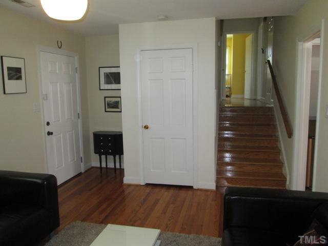 3409 Astro Court Raleigh, NC 27604 - Photo 10 of 25 Another view of the living room that features hardwoods floors that were refinished in 2011, and also a coat closet that is a real convenience for hanging your coats, sweaters, raincoats, and also guests coats when you have company!