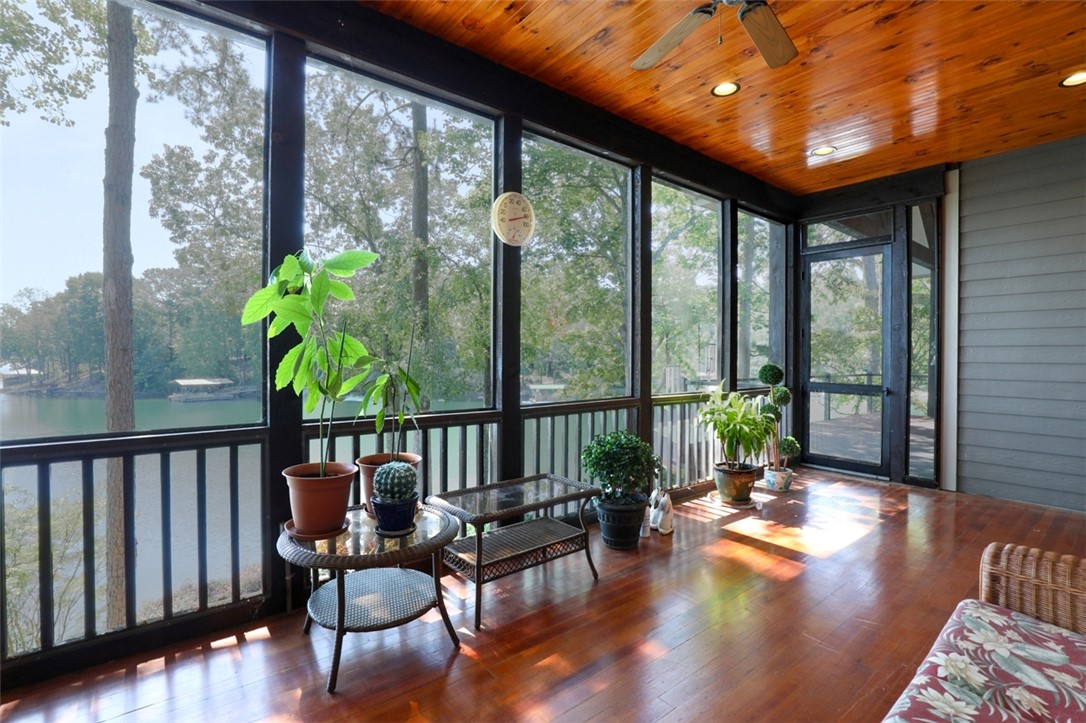 3 Horizon Pointe Lane Salem, SC 29676 - Photo 19 of 30 This bright sunroom with gleaming hardwood floors offers serene lake and lush tree views.