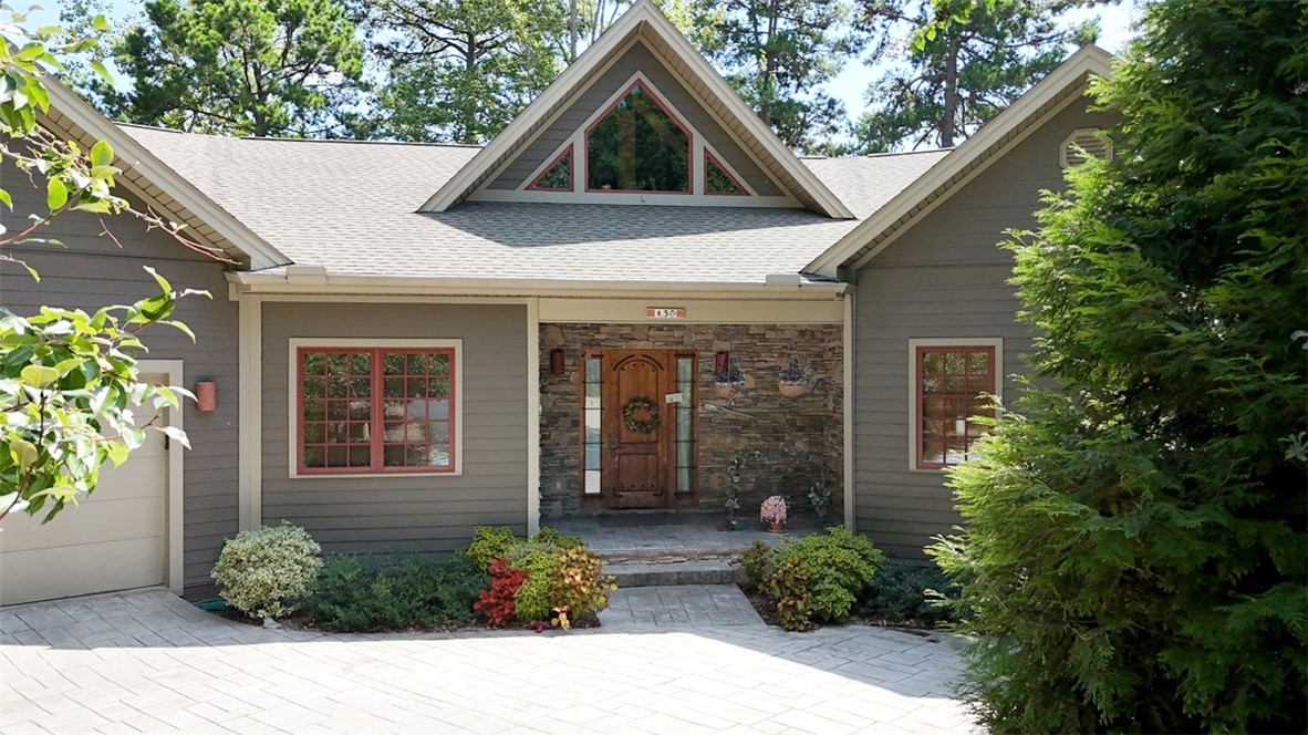 3 Horizon Pointe Lane Salem, SC 29676 - Photo 2 of 30 This captivating home boasts an inviting entrance with a stone facade and elegant wooden door.