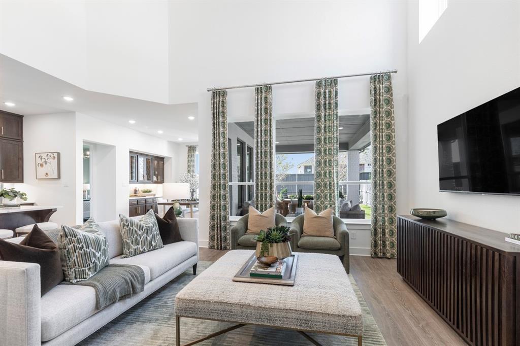 11505 Hardwick Road Haslet, TX 76052 - Photo 13 of 39 a living room with furniture and a flat screen tv