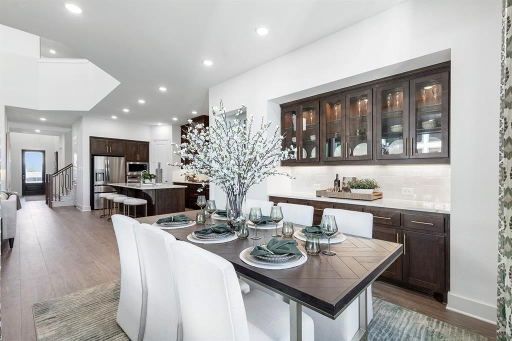 11505 Hardwick Road Haslet, TX 76052 - Photo 27 of 39 a living room with furniture a flat screen tv and kitchen view