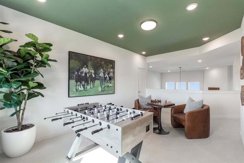 11505 Hardwick Road Haslet, TX 76052 - Photo 32 of 39 a living room with furniture a potted plant and a table