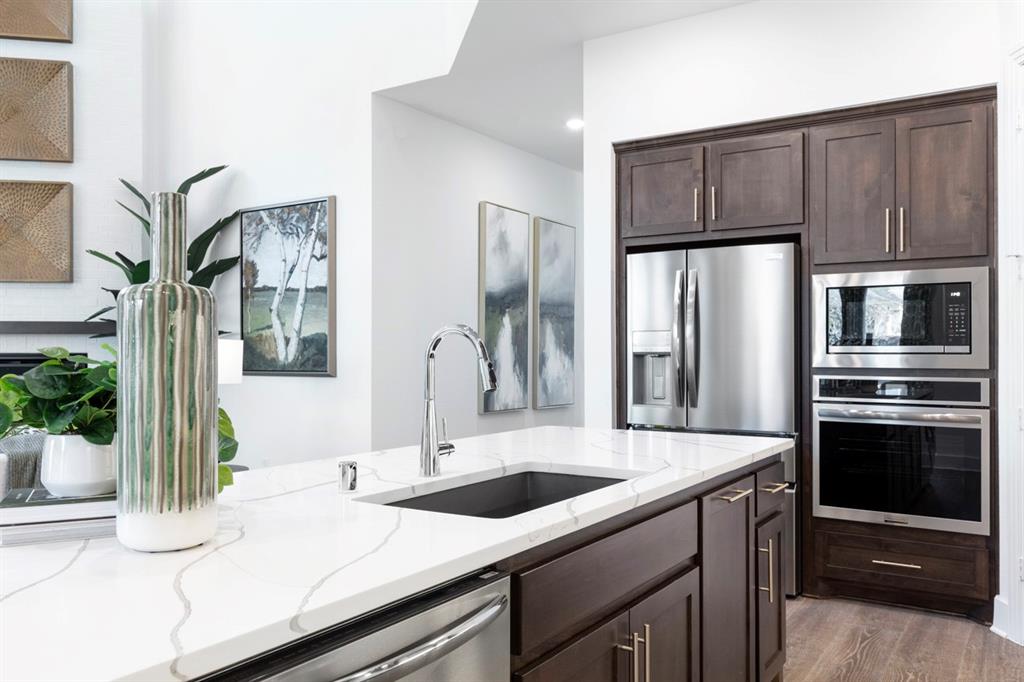11505 Hardwick Road Haslet, TX 76052 - Photo 5 of 39 a kitchen with stainless steel appliances kitchen island granite countertop a refrigerator and a sink