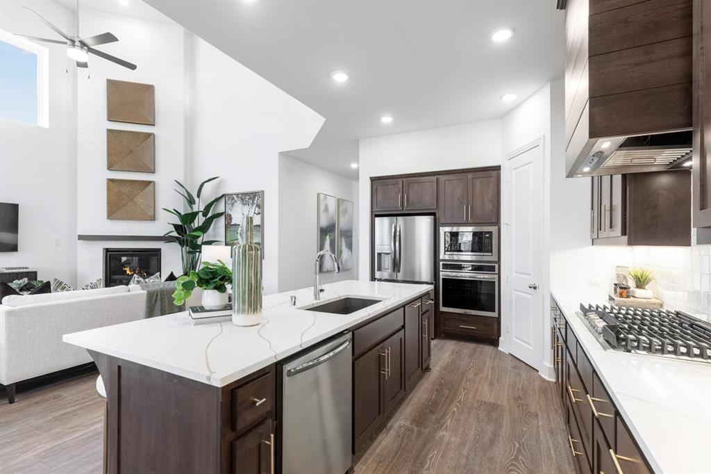 11505 Hardwick Road Haslet, TX 76052 - Photo 7 of 39 a kitchen with a sink stove and refrigerator