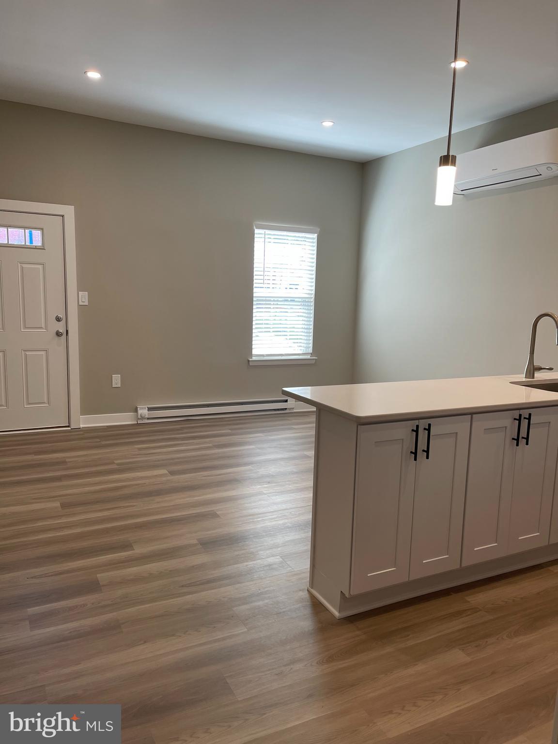 189 Bridge Street, Unit 2 Phoenixville, PA 19460 - Photo 4 of 10 a view of a room with wooden floors