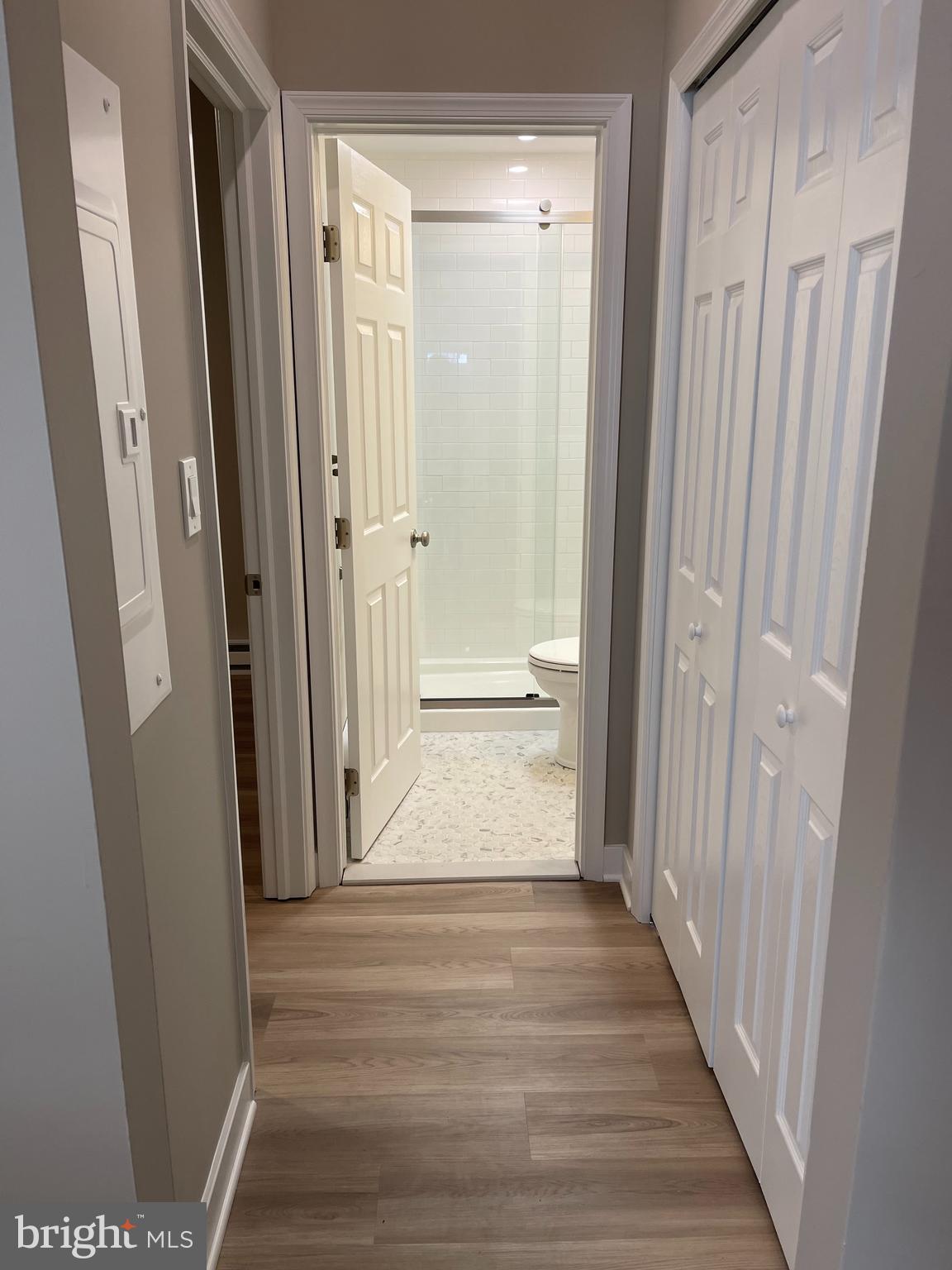 189 Bridge Street, Unit 2 Phoenixville, PA 19460 - Photo 5 of 10 a view of a hallway with wooden floor and staircase