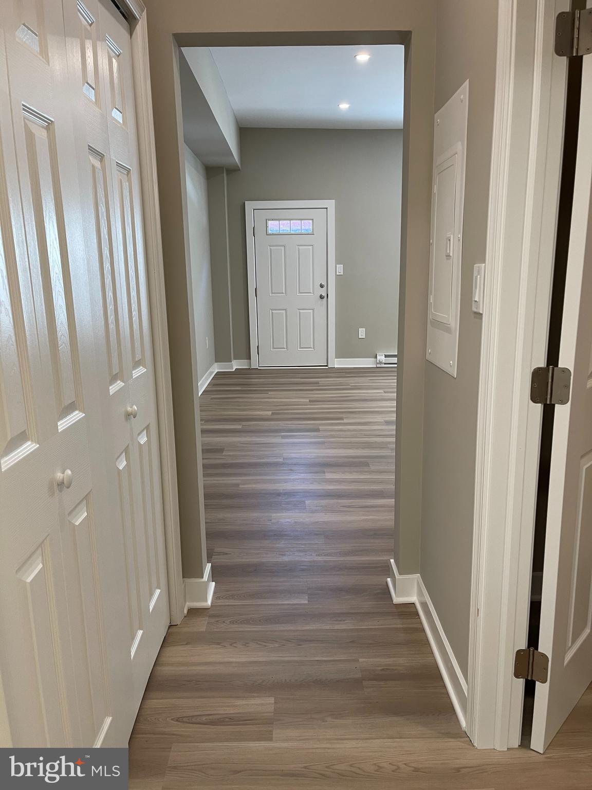 189 Bridge Street, Unit 2 Phoenixville, PA 19460 - Photo 7 of 10 a view of a hallway with wooden floor and staircase