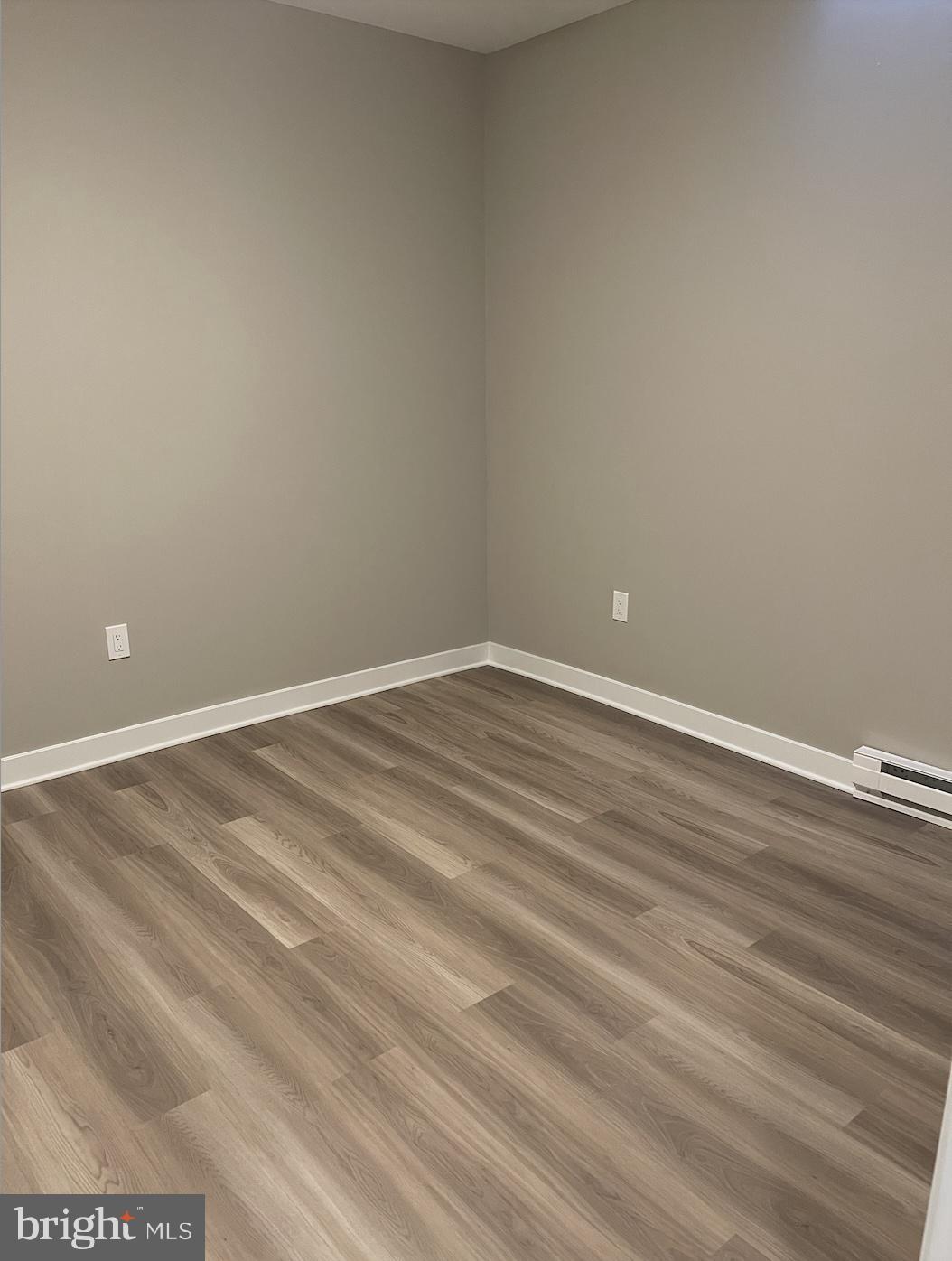 189 Bridge Street, Unit 2 Phoenixville, PA 19460 - Photo 8 of 10 a view of empty room with wooden floor