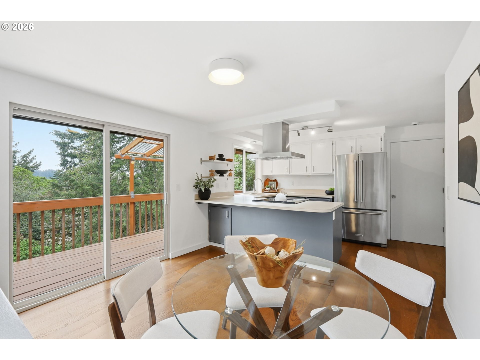 3834 Onyx Street Eugene, OR 97405 - Photo 17 of 43 a kitchen with a refrigerator and wooden floor
