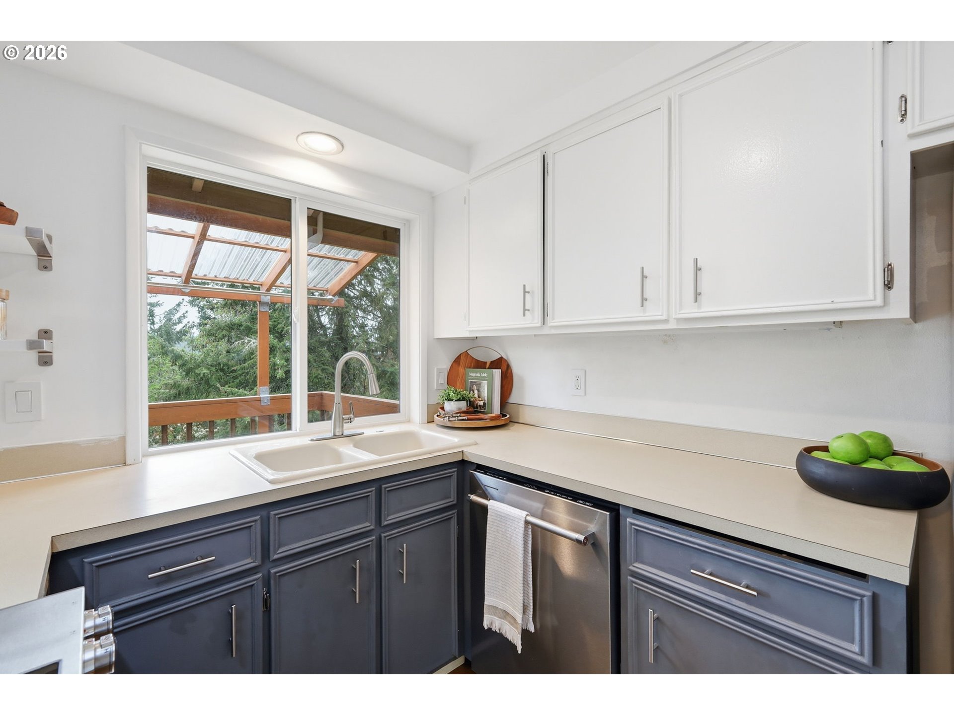 3834 Onyx Street Eugene, OR 97405 - Photo 19 of 43 a kitchen with granite countertop a sink window and cabinets