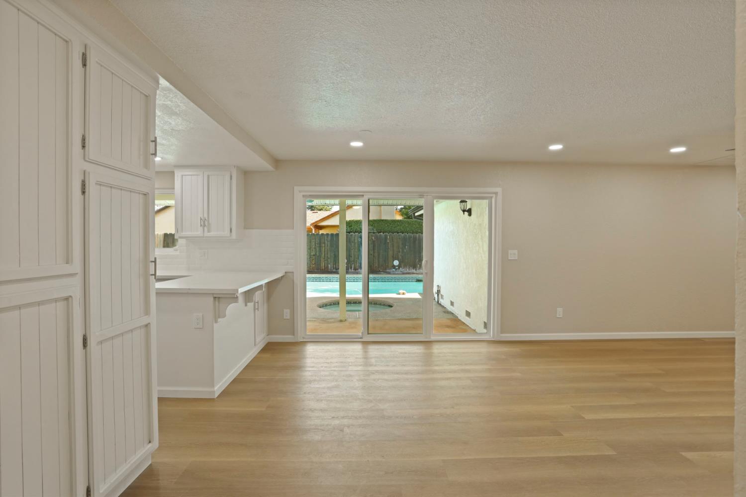 3524 Marsala Way Modesto, CA 95356 - Photo 16 of 40 a view of an empty room with wooden floor and a window