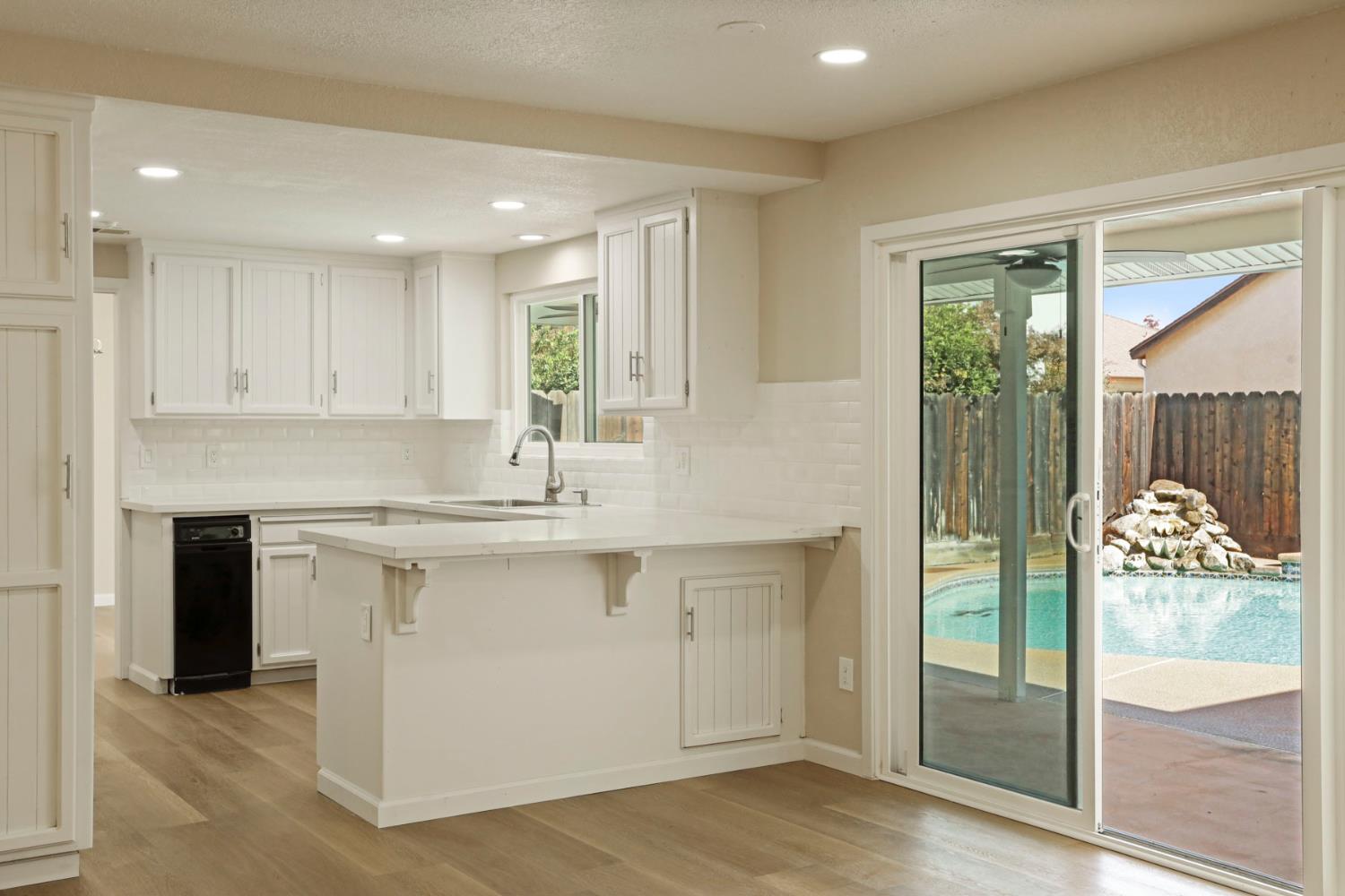 3524 Marsala Way Modesto, CA 95356 - Photo 19 of 40 a kitchen with a sink and refrigerator