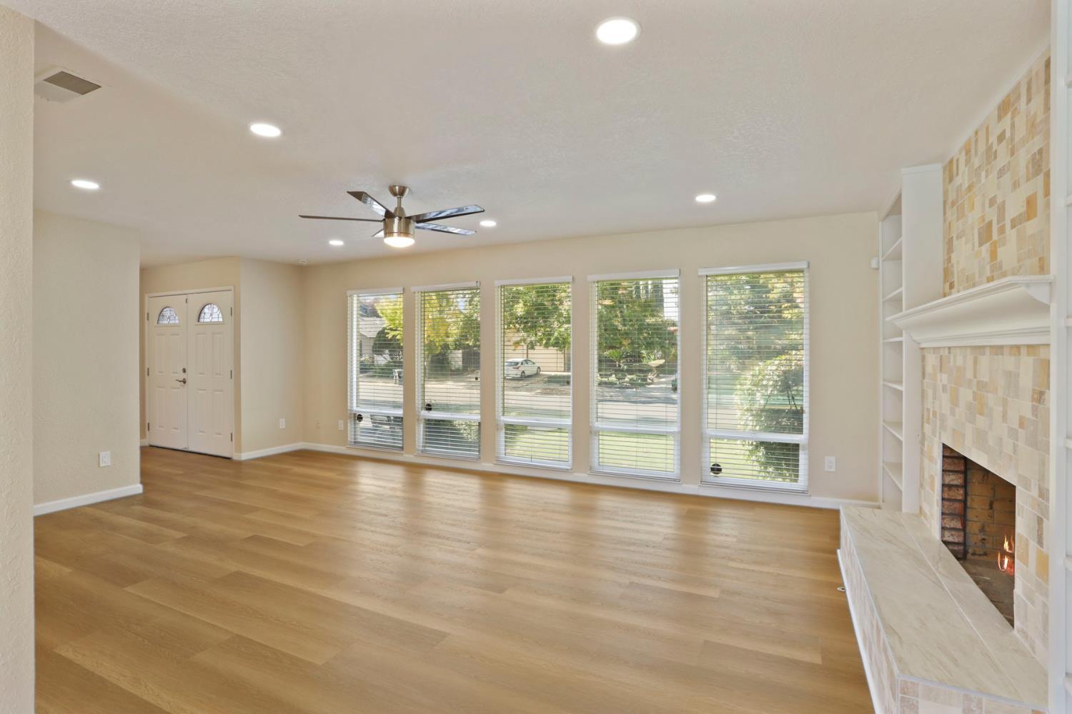 3524 Marsala Way Modesto, CA 95356 - Photo 21 of 40 a view of an empty room with a window and wooden floor