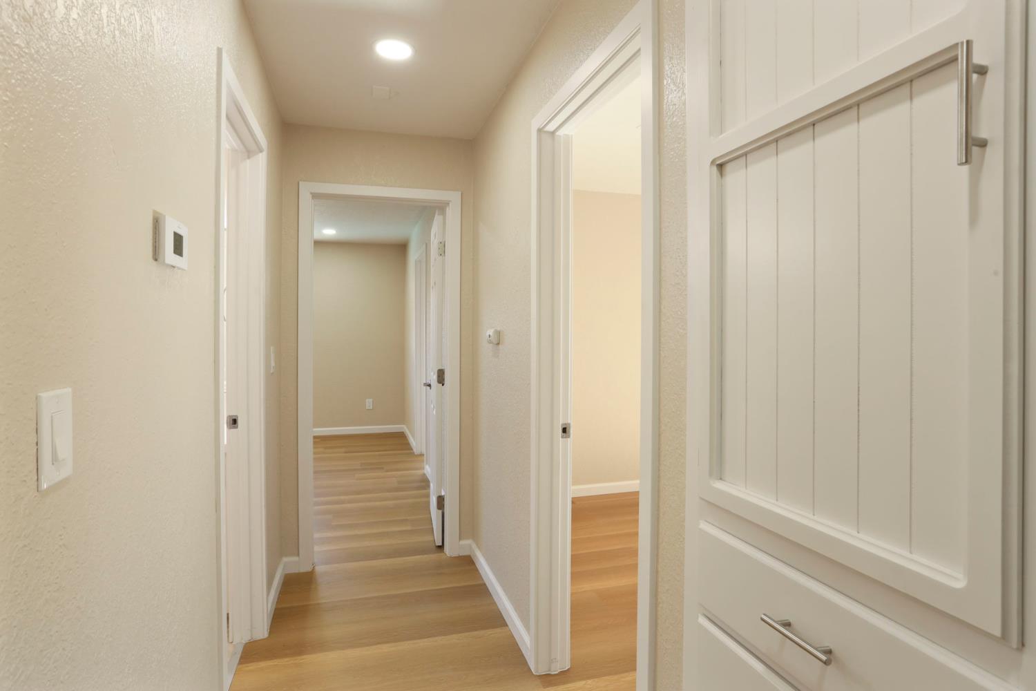 3524 Marsala Way Modesto, CA 95356 - Photo 22 of 40 a view of a hallway with wooden floor and entryway