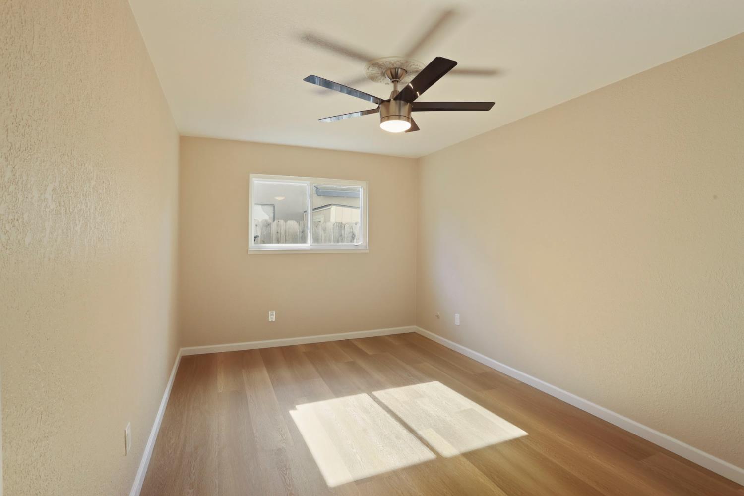 3524 Marsala Way Modesto, CA 95356 - Photo 24 of 40 an empty room with a window and a fan