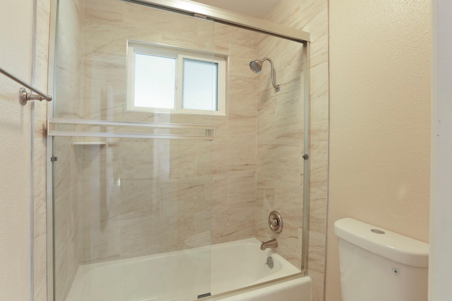3524 Marsala Way Modesto, CA 95356 - Photo 29 of 40 a bathroom with a shower a toilet and a sink