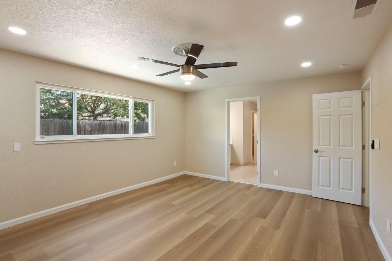 3524 Marsala Way Modesto, CA 95356 - Photo 31 of 40 a view of a livingroom with a ceiling fan and window