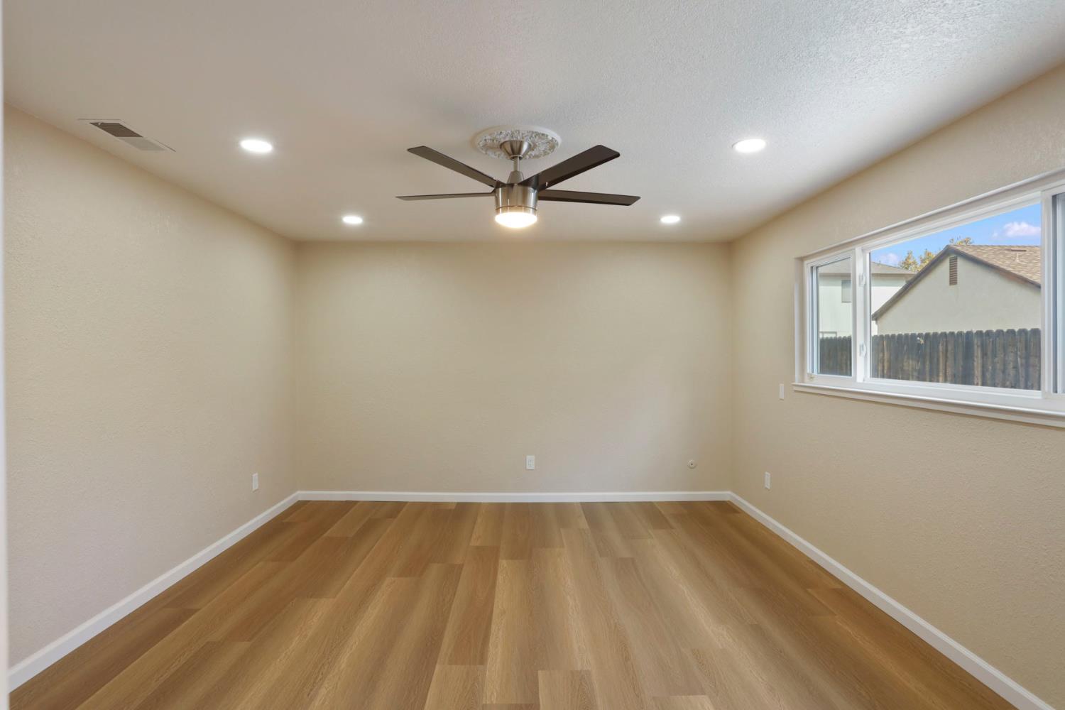 3524 Marsala Way Modesto, CA 95356 - Photo 32 of 40 wooden floor in an empty room with a window