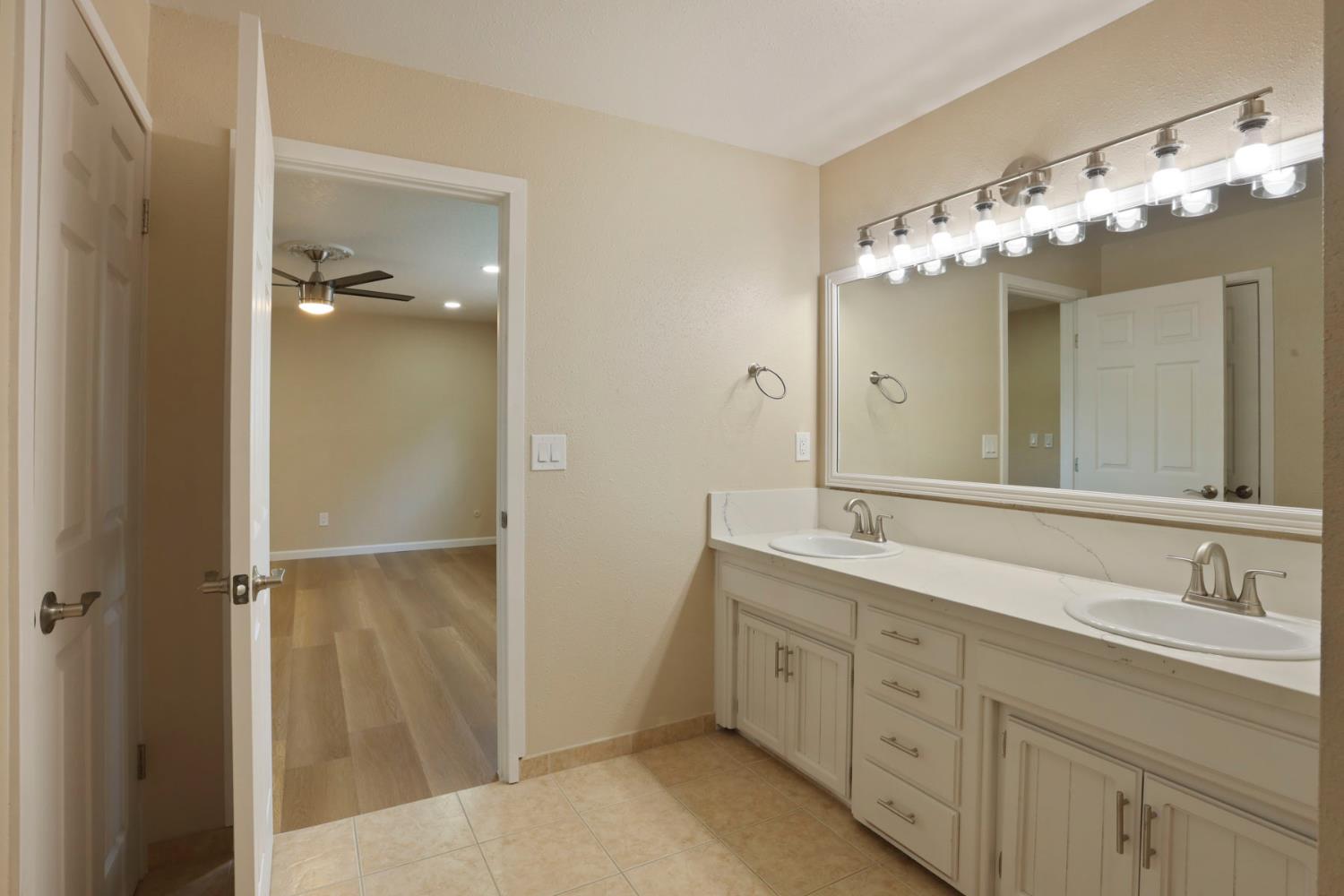 3524 Marsala Way Modesto, CA 95356 - Photo 34 of 40 a bathroom with a double vanity sink and a mirror
