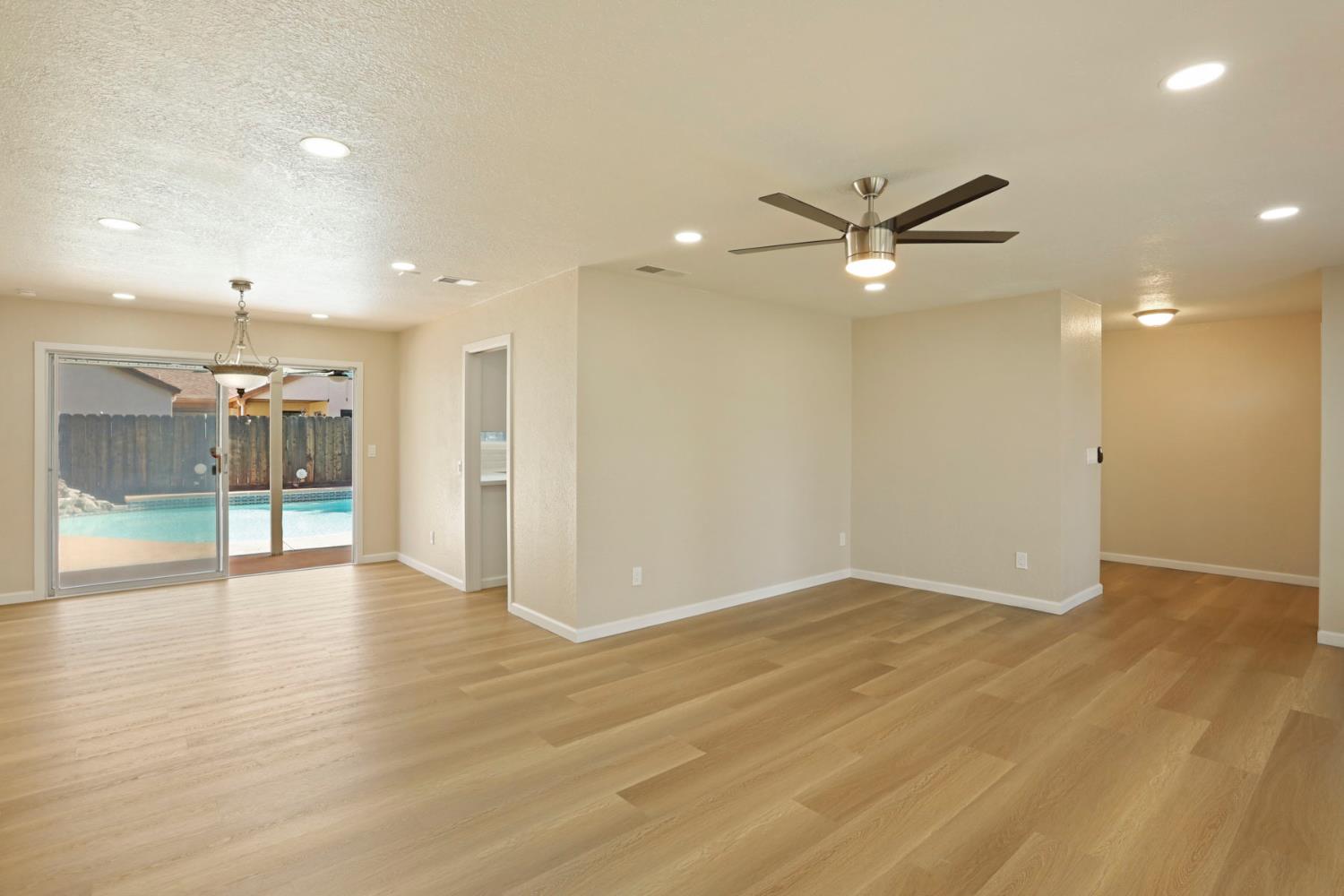 3524 Marsala Way Modesto, CA 95356 - Photo 8 of 40 an empty room with wooden floor and a ceiling fan