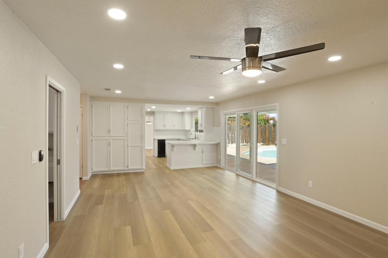 3524 Marsala Way Modesto, CA 95356 - Photo 10 of 40 a view of a kitchen with wooden floor and a ceiling fan