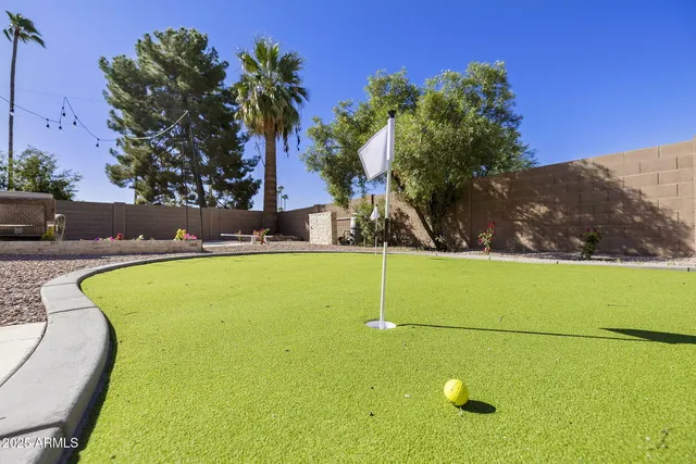 a view of a swimming pool with a chairs