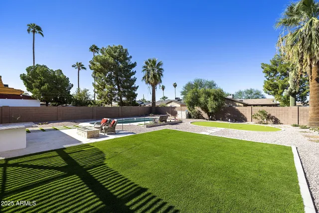 a view of a swimming pool and an outdoor space
