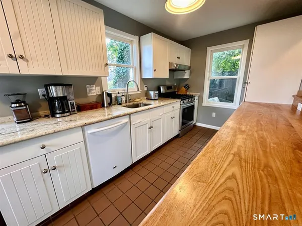 a kitchen with sink and window