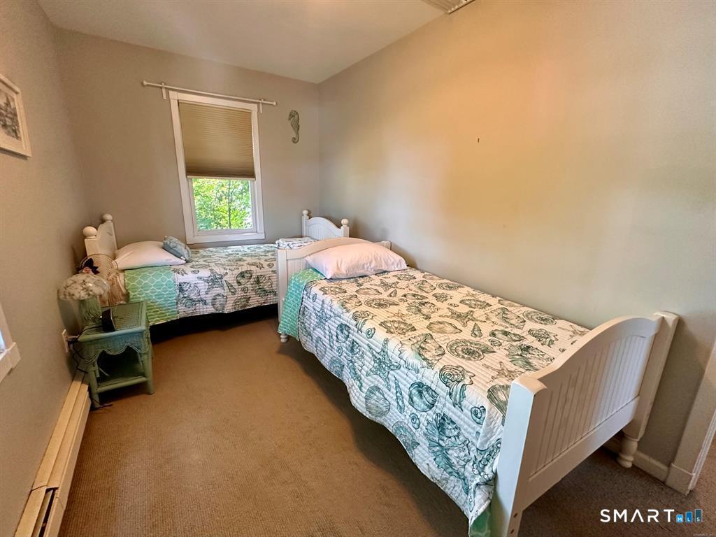 44 Warren Street Milford, CT 06460 - Photo 16 of 29 a bedroom with a bed and a window