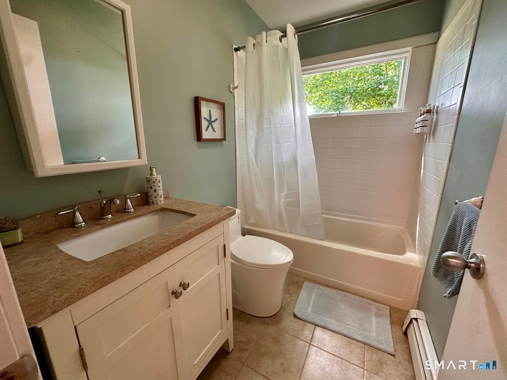 44 Warren Street Milford, CT 06460 - Photo 19 of 29 a bathroom with a granite countertop sink toilet and shower