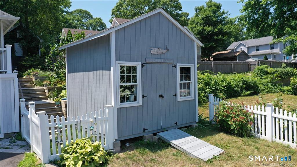 44 Warren Street Milford, CT 06460 - Photo 26 of 29 a backyard of a house with outdoor seating garden