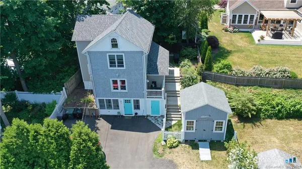 an aerial view of a house with outdoor space
