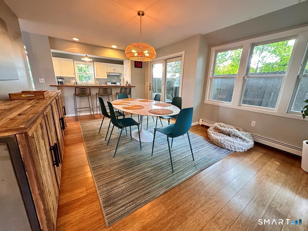 44 Warren Street Milford, CT 06460 - Photo 8 of 29 a view of a dining room with furniture and wooden floor