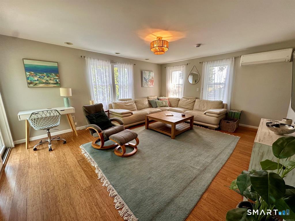 44 Warren Street Milford, CT 06460 - Photo 10 of 29 a living room with furniture and a large window