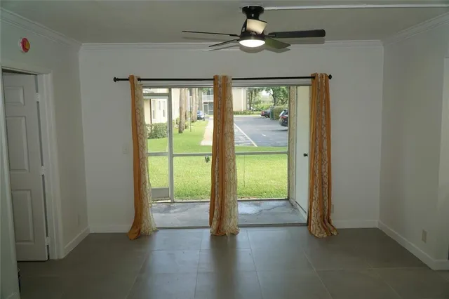a view of an empty room with a window