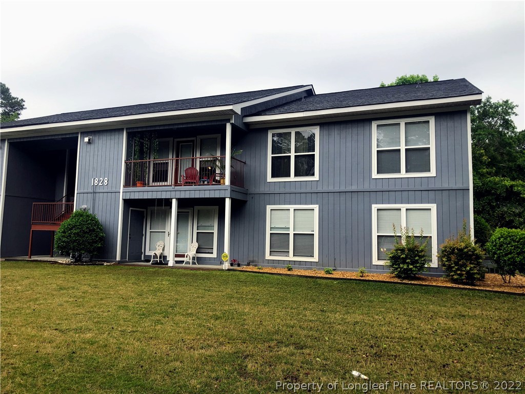 1828 Sardonyx Road, Unit 3 Fayetteville, NC 28303 - Photo 1 of 22 a front view of a house with a yard