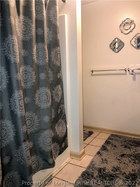 1828 Sardonyx Road, Unit 3 Fayetteville, NC 28303 - Photo 15 of 22 a bathroom with a shower