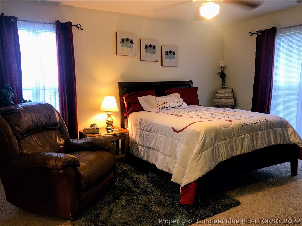 1828 Sardonyx Road, Unit 3 Fayetteville, NC 28303 - Photo 18 of 22 a bedroom with bed couch and window