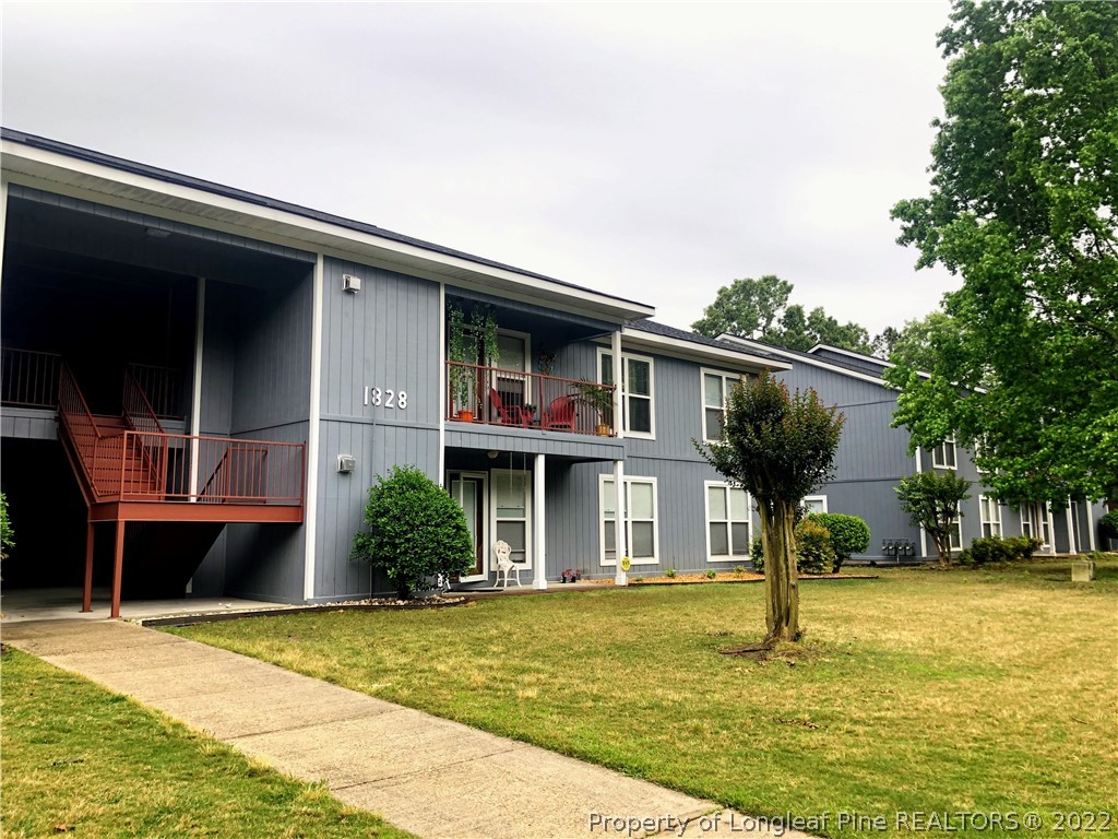 1828 Sardonyx Road, Unit 3 Fayetteville, NC 28303 - Photo 2 of 22 a front view of a house with a yard