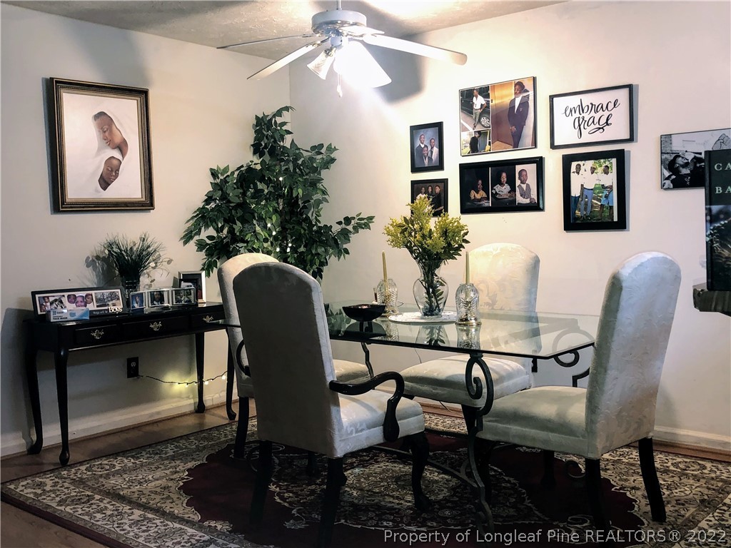 1828 Sardonyx Road, Unit 3 Fayetteville, NC 28303 - Photo 5 of 22 a view of a dining room with furniture and a potted plant