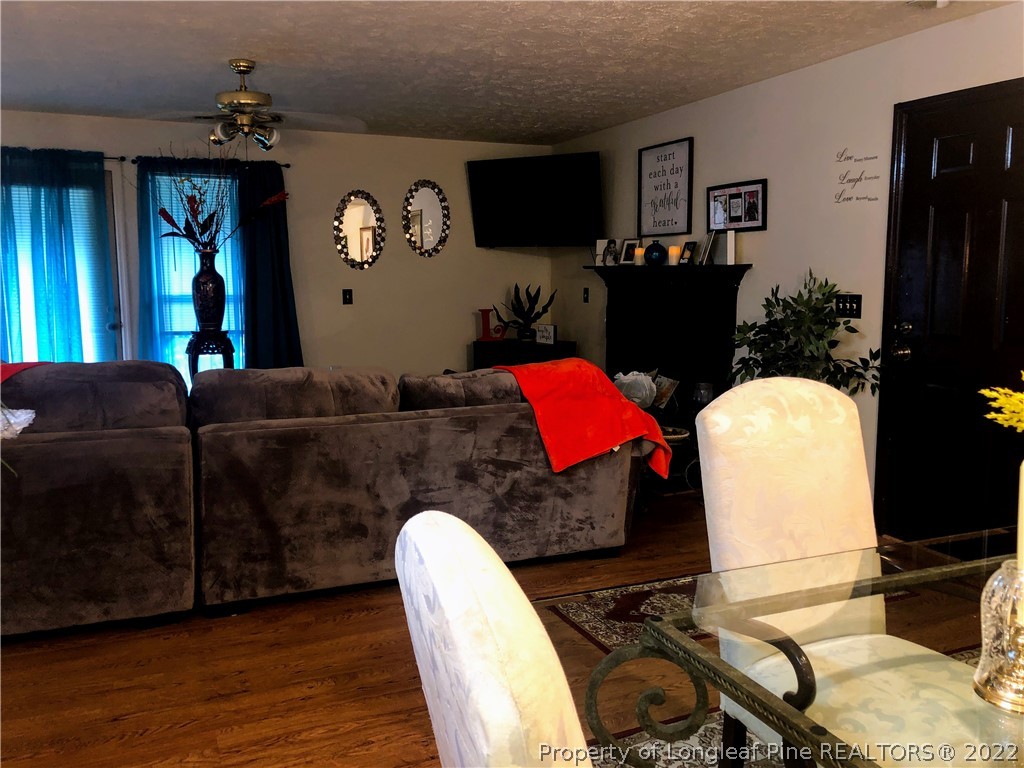 1828 Sardonyx Road, Unit 3 Fayetteville, NC 28303 - Photo 6 of 22 a living room with furniture rug and wooden floor