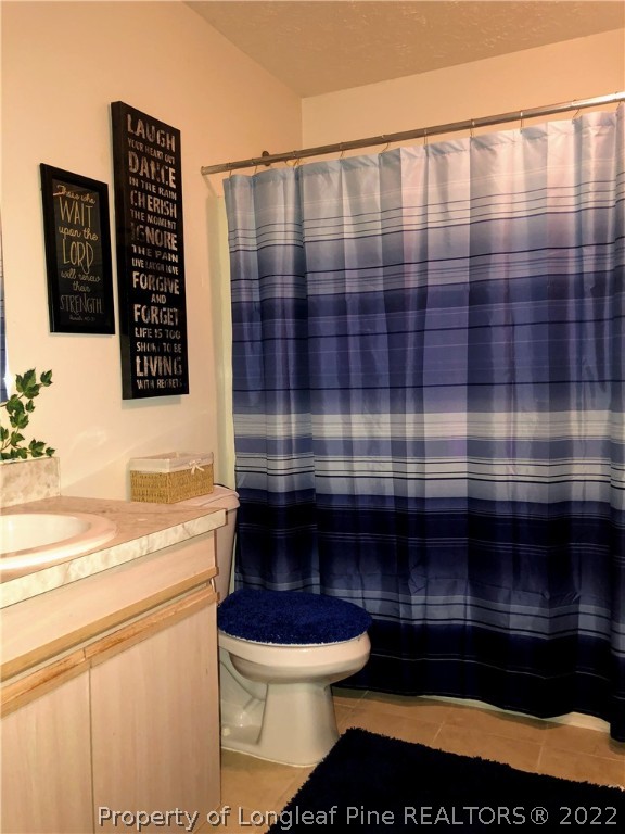 1828 Sardonyx Road, Unit 3 Fayetteville, NC 28303 - Photo 10 of 22 a bathroom with a toilet and a shower