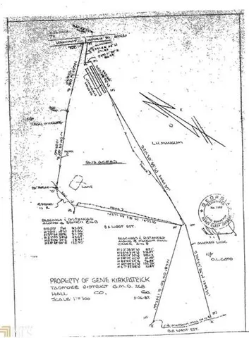 a picture of a room with a white bed and a painting on the wall