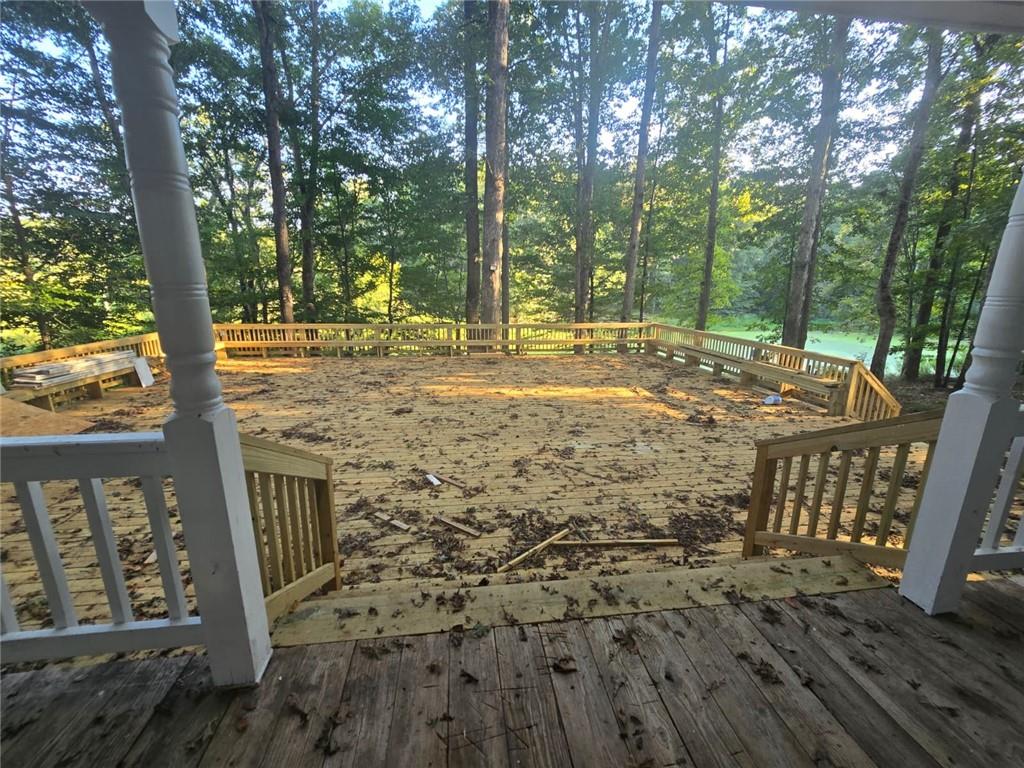 3738 Harmony Church Road Gainesville, GA 30507 - Photo 5 of 12 a view of a porch with a tree