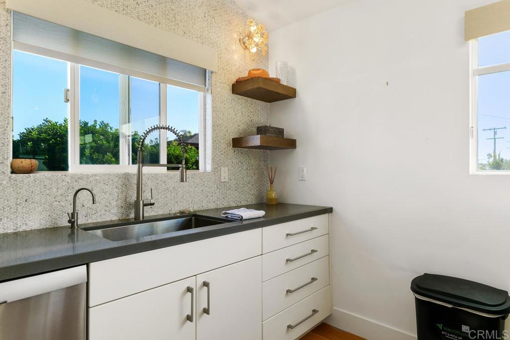721 3rd Street Encinitas, CA 92024 - Photo 29 of 36 a kitchen with a sink and a window